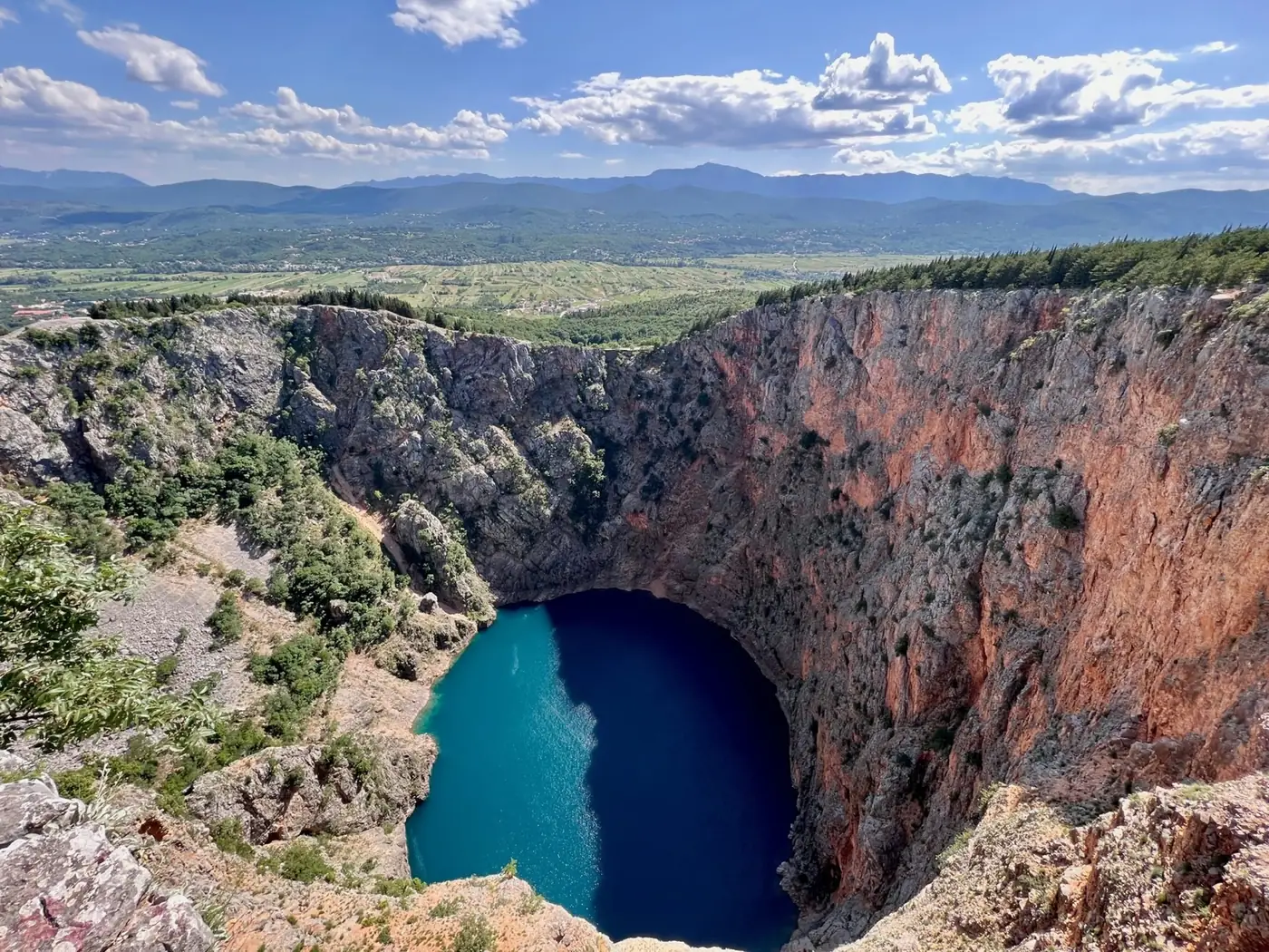Blue Lake (Modro Jezero) at Imotski with steep karst cliffs, Dalmatia, Croatia